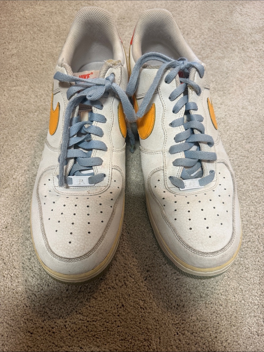 Nike Men’s Air Force One low topin White with Yellow Swoosh and Light Blue Laces